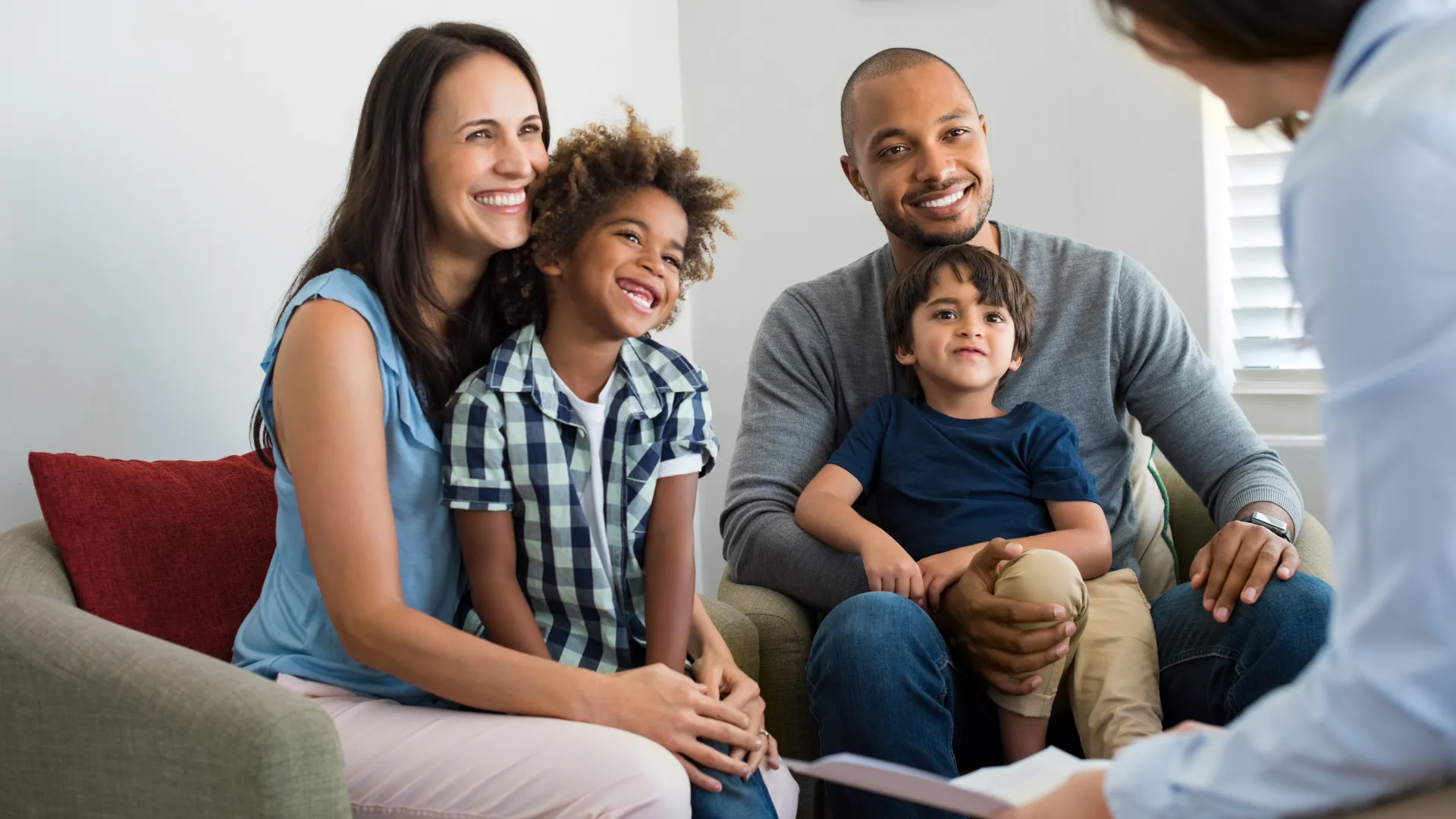 Partnering with Families, Supporting Every Step Family meeting with a casework professional while sitting together at home